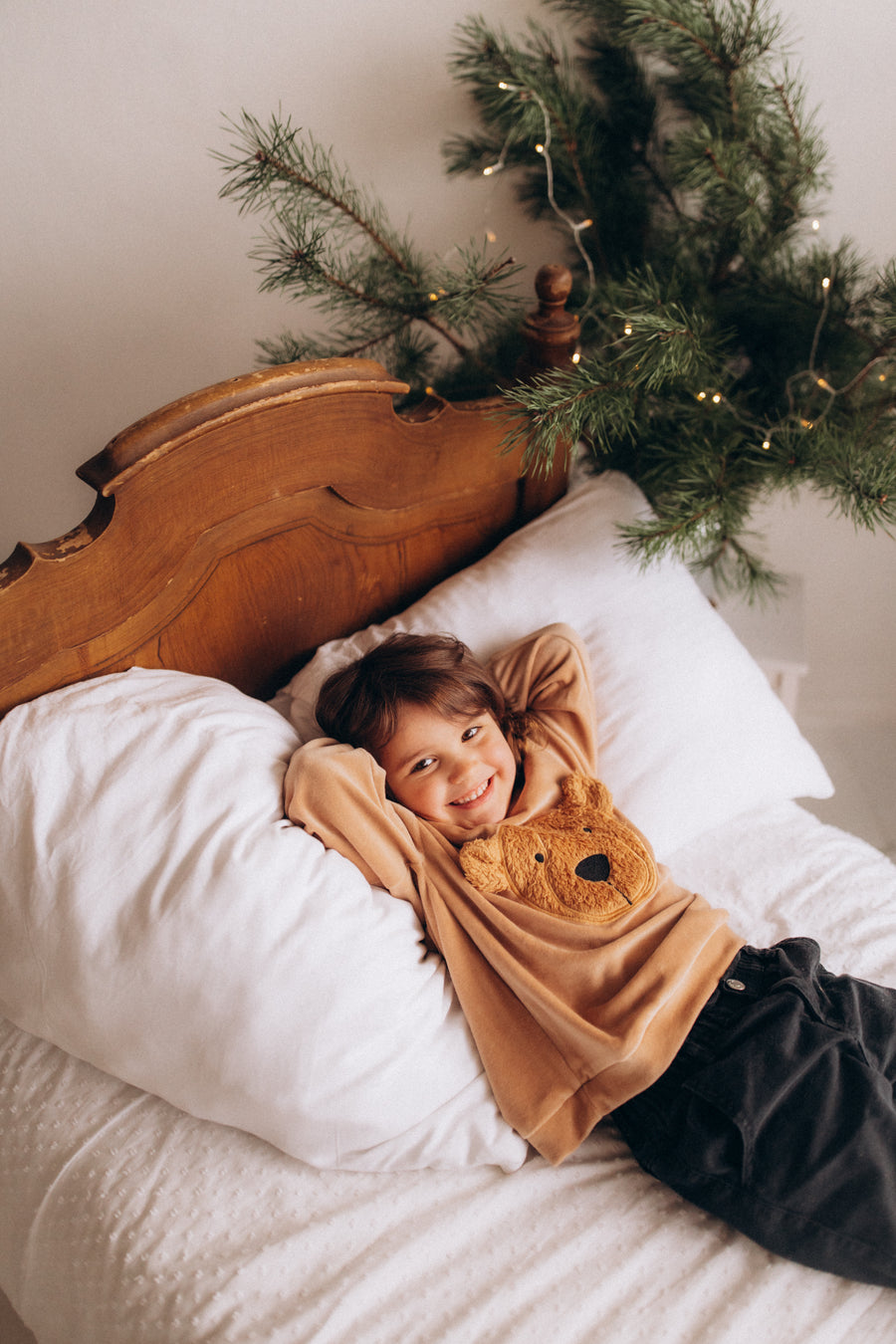 Baby resting in Wooly Organic merino sleepwear
